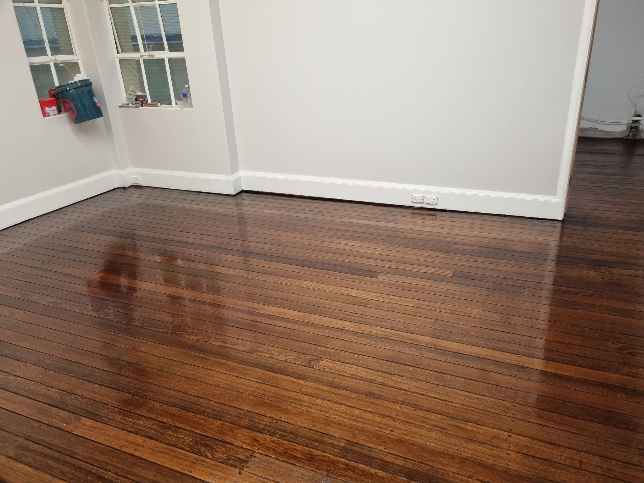 Dark stained polished timber floorboards — Sydney floor restoration